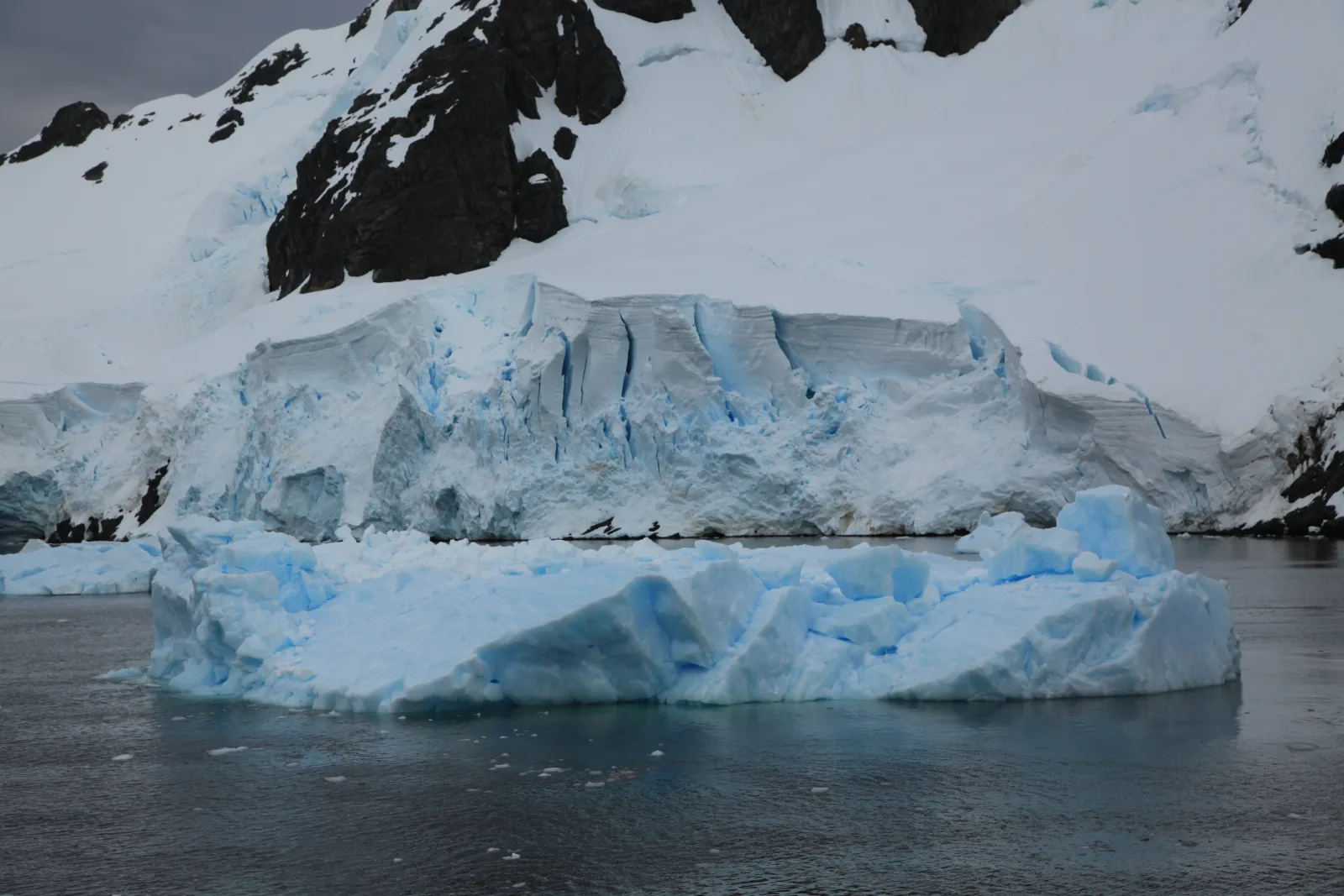 Iceberg and glacier in the Lemaire Channel, Antarctica
